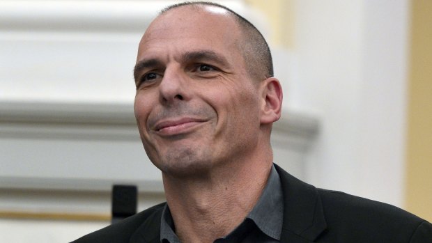 Greek Finance Minister Yanis Varoufakis smiles during the civil oath ceremony at the Presidential Palace in Athens on Tuesday.