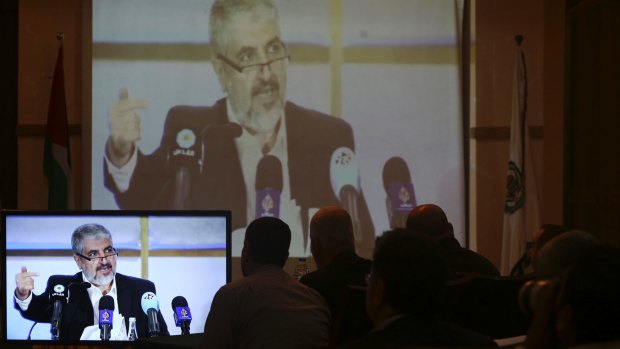 Hamas leaders and supporters in Gaza City listen to Khaled Mashaal, the outgoing Hamas leader, launch a new manifesto from Doha, Qatar, in May.