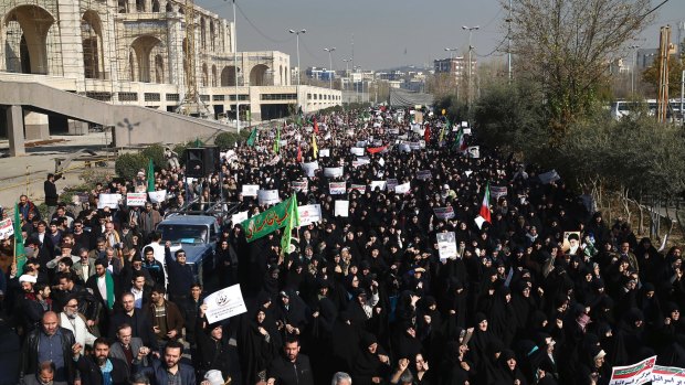 Iranian protesters chant slogans at a rally in Tehran, Iran, on Saturday.