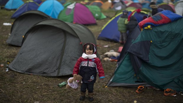 A Syrian refugee child in the makeshift camp for asylum seekers in Roszke, southern Hungary, on Thursday.