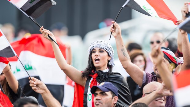 Good show: Iraq fans show their support during the Asian Cup.