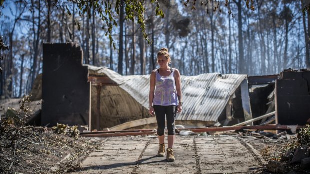 Juvette Jory looks at the rubble of her family home in Tathra: It was a horrifying experience, just like a movie.