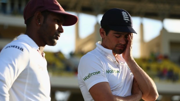 Alastair Cook (R), the captain of England, alongside Denesh Ramdin, the captain of the West Indies, at the end of the match.