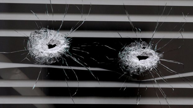 Bullet holes next to the La Belle Equipe cafe in Paris.