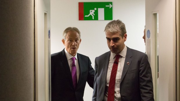 No need to rush to the exit: Tony Blair, left, arrives to deliver a speech during an Open Britain event on Friday
