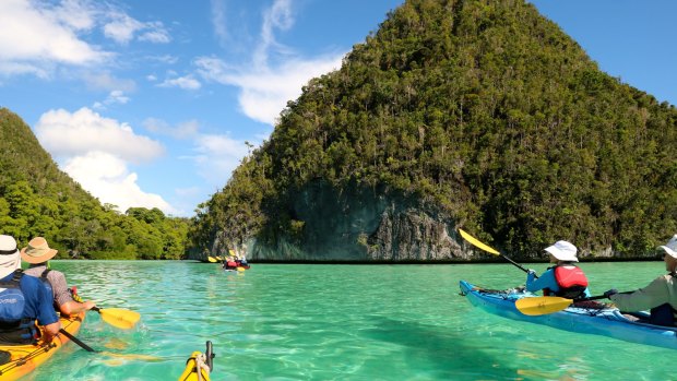 Paddling through Raja's karst islands.