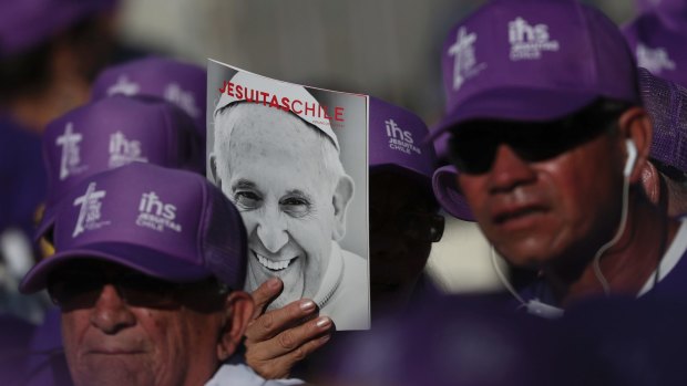 Chileans wait for the arrival of Pope Francis to the shrine of St. Alberto Hurtado in Santiago.