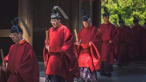 Shinto priests dressed in the traditional outfit ''kariginu'' and hat ''eboshi'' taking part in a ceremony at Meiji shrine in Tokyo.