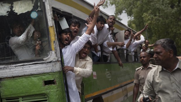 Activists of India's Congress Party's youth wing shout slogans from a bus.