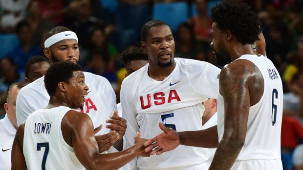 Huddle: Kyle Lowry with teammates DeAndre Jordan, DeMarcus Cousins and Kevin Durant during the Group A game between the United States and France.