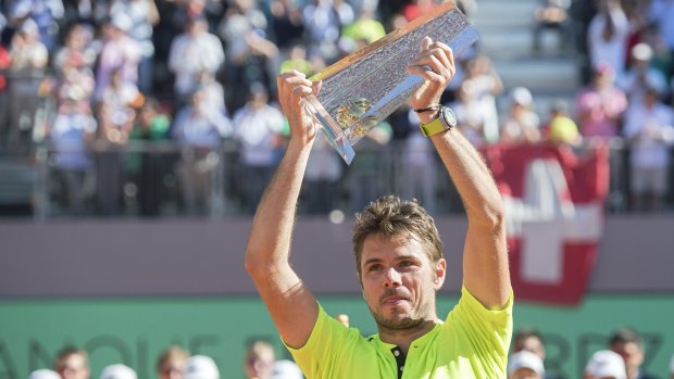 Popular champion: Switzerland's Stan Wawrinka holds the trophy after beating Marin Cilic, of Croatia, during the final of the Geneva Open.