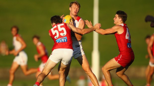 Grounded: Callum Mills is tackled during the Swans' intra-club trial at Henson Park last month.