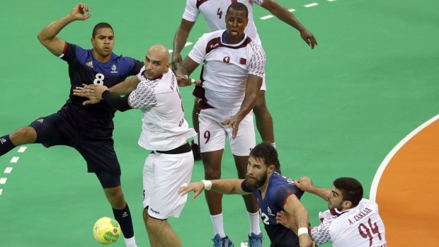 From left, France's Daniel Narcisse, Qatar's Marko Bagaric,  and Rafael Capote, France's Luka Karabatic and Qatar's Ameen Zakkar on Tuesday.