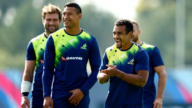 Happy campers: Wallabies halfback Will Genia (right) with teammate Israel Folau.