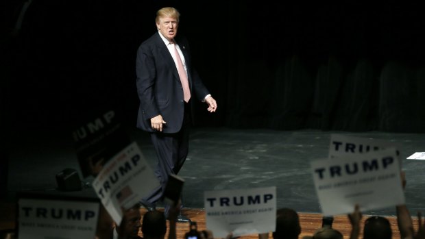 Republican presidential candidate Donald Trump greets supporters before speaking at a rally on Saturday.