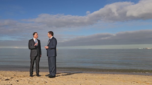 Greg Hunt and Matthew Guy at Port Melbourne beach.