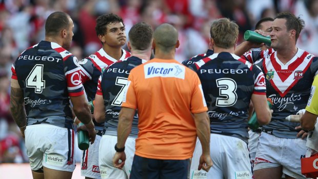 Regretful: Latrell Mitchell looks dejected after a Dragons try.