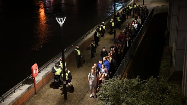 People are led to safety away from London Bridge hours after the attack. 