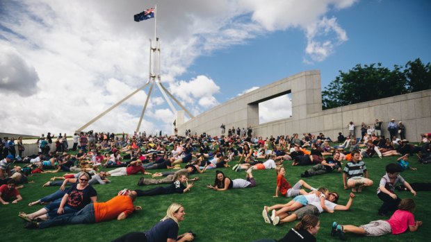 Hundreds rolled down the lawns of Parliament House to protest against the fence proposal.