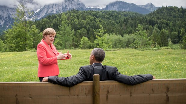 German Chancellor Angela Merkel chats with US President  Barack Obama outside the Elmau Castle.