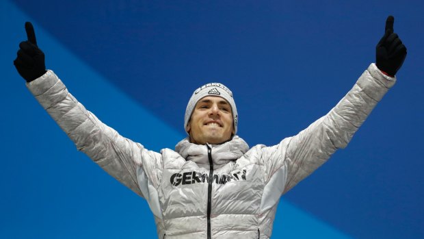 Germany's Simon Schempp was excited to win a silver medal and also to drink a non-alcoholic beer after the 15-kilometre mass start.