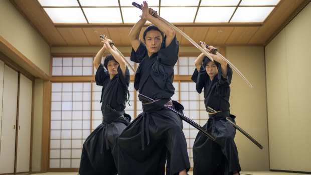 Japanese martial arts athlete training kendo in a dojo.