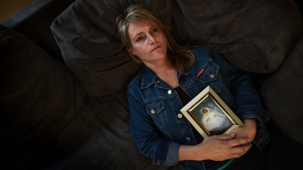 Deborah Pum, with a picture of her baby Cory who was stillborn at Bacchus Marsh hospital.