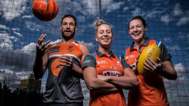 (From left) AFL GWS Giants Shane Mumford with Giants Netball players Jamie-Lee Price and Sam Poolman. 