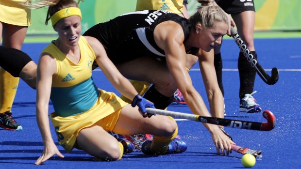 Australia's Emily Smith, left, fights for the ball with New Zealand's Stacey Michelsen.
