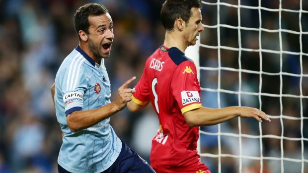 Man of the moment:  Alex Brosque wheels away in celebration after scoring his second.