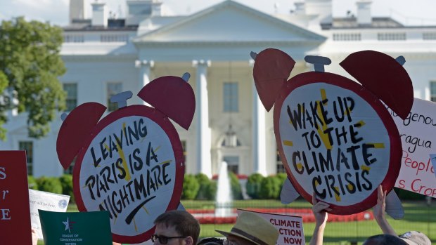 Protesters gather outside the White House in Washington on Thursday.