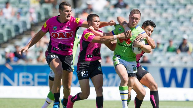 Heatwave: Raiders player Jack Wighton is tackled by Penrith.