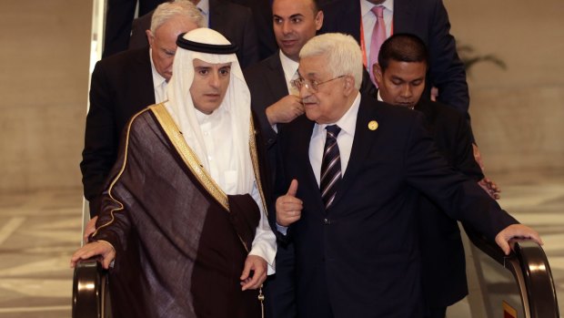 Palestinian President Mahmoud Abbas, right, talks to Saudi Arabia's Foreign Minister Adel al-Jubeir at the extraordinary Organisation of Islamic Cooperation (OIC) summit on Monday. 
