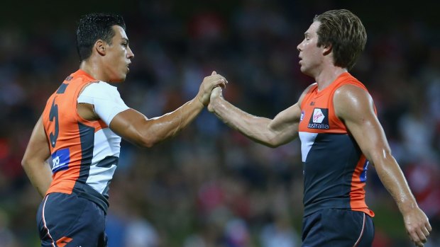 Dylan Shiel of the Giants and teammate Toby Greene acknowledge each other's efforts after a goal.