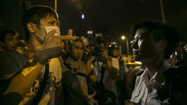 Police face off with protesters in central Hong Kong on Thursday.