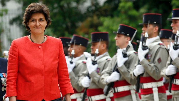 Newly named French Defence Minister Sylvie Goulard reviews an honour guard during an handover ceremony with her predecessor, Jean-Yves Le Drian, in Paris.