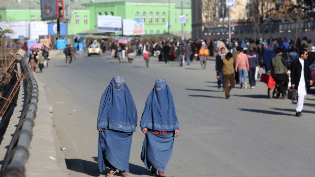 Afghan women walk on a street in Kabul, Afghanistan. 