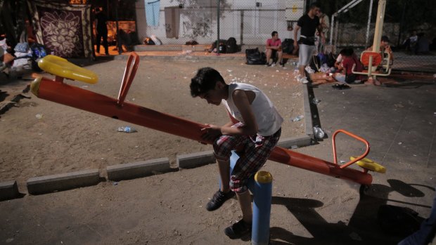 A Syrian migrant in a park in the coastal town of Bodrum, Turkey, waiting for the chance to cross with boats to the nearby Greek island of Kos.