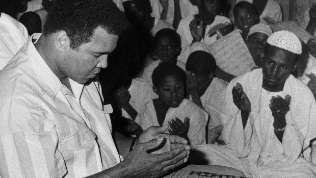 Former world heavyweight boxing champion Muhammad Ali, who has condemned Donald Trump's remarks about banning Muslims from entering the United States, is seen here in 1988 praying at a mosque in Khartoum, Sudan. 