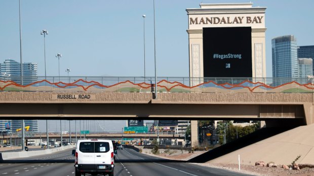 President Donald Trump's motorcade passes the Mandalay Bay Resort and Casino on the way to meet with victims and first responders of the mass shooting.
