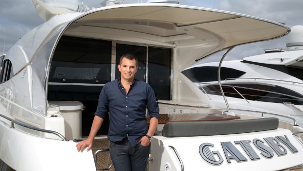 Young entrepreneur Rory Vassallo in his motor boat 'Gatsby', on the Swan River