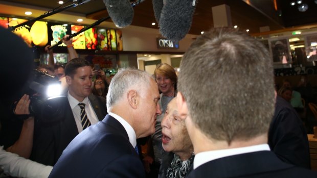 Prime Minister Malcolm Turnbull greets an enthusiastic voter.