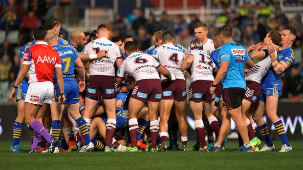 Push and shove: Manly players scuffle during a fiery first half against the Eels at Parramatta last Friday.