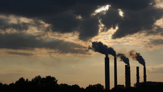 The silhouettes of emissions are seen rising from a power plant  in Owensville, Indiana on July 23.