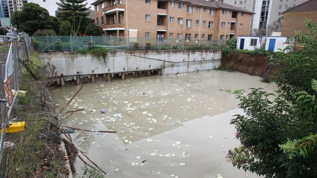 Erosion and flooding at a vacant construction site is believed to have caused the flooding. 