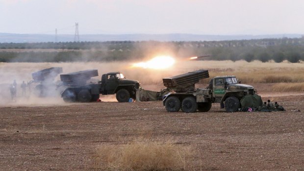 Syrian army rocket launchers fire near the village of Morek on Wednesday. 