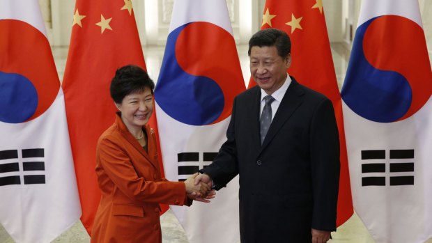 'Closely aligned': South Korean President Park Geun-hye and Chinese President Xi Jinping meet on the sidelines of the APEC summit on Monday.