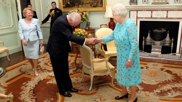 The Queen greets former Australian prime minister John Howard.