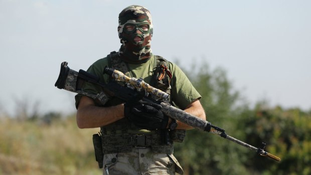 A pro-Russian rebel sniper on the outskirts of Shakhtersk in eastern Ukraine, July 2014.