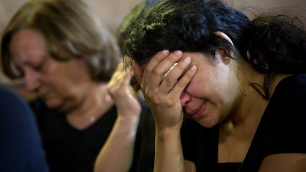 Coptic Christians grieve during prayers  remembering the victims of EgyptAir flight 804 at Al-Boutrossiya Church in Cairo.